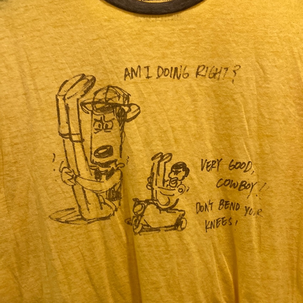 Disney / Pixar Backstage lightweight brown and yellow tshirt men’s medium
